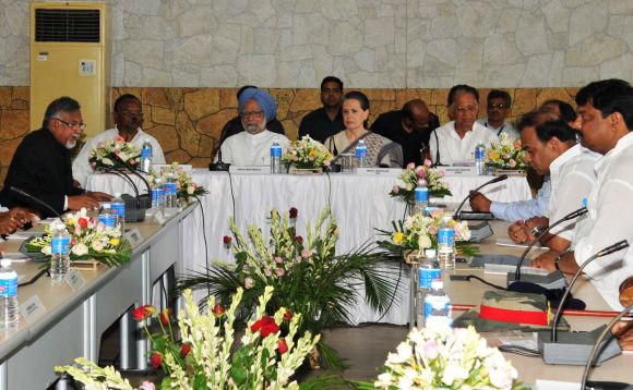 PM Singh, Congress chief Sonia Gandhi and CM Gogoi discuss the flood crisis with authorities during a meeting in Guwahati on Monday