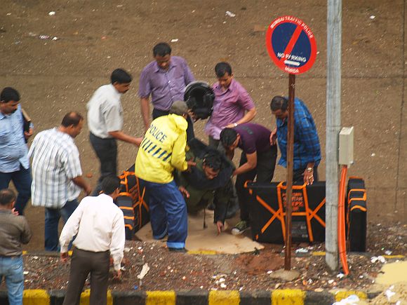 Members of the bomb disposal squad investigating the suspicious object found outside Andheri's Infiniti Mall on Wednesday