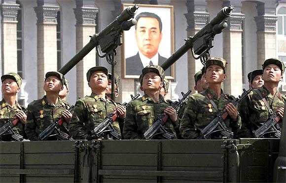 Soldiers on a military truck take part in a military parade to celebrate the centenary of the birth of North Korea's founder Kim Il-sung in Pyongyang