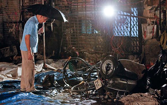 A police official inspects the blast site at Opera House