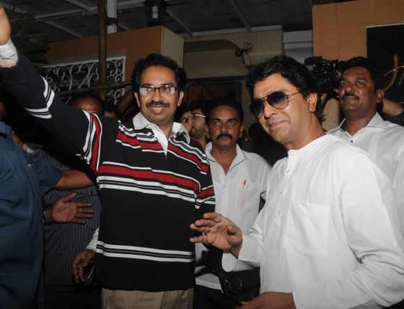 Uddhav and Raj Thackeray pose for the media outside Bandra's Lilavati Hospital