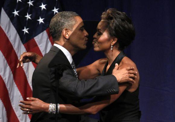 United States President Barack Obama kisses first lady Michelle Obama after she introduced him to speak at a fund raiser in New York