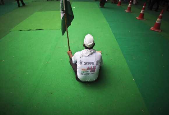 A supporter of veteran Indian social activist Anna Hazare, takes part in a protest in New Delhi July 25