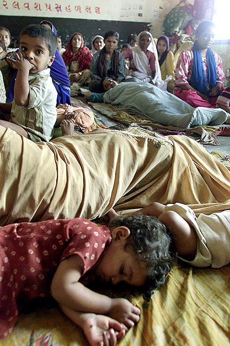 Children sleep at a relief camp in Ahmedabad in 2002