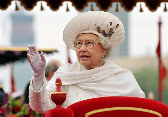 Britain's Queen Elizabeth waves from the Spirit of Chartwell during the Diamond Jubilee River Pageant on the River Thames, in London on Sunday