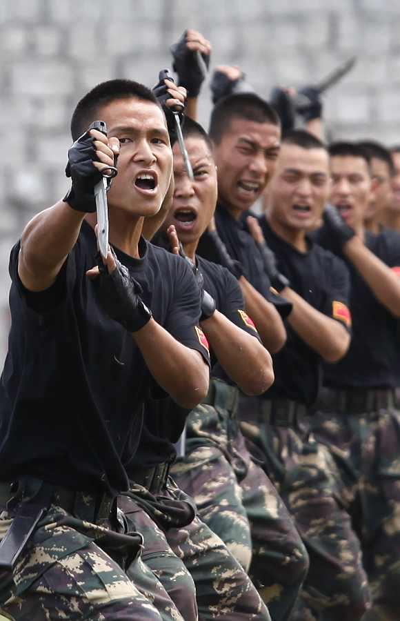 People's Liberation Army soldiers demonstrate their martial arts skills