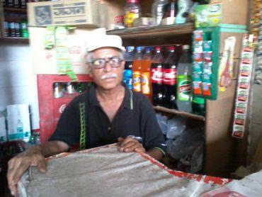 Grocery store owner, Deena Nath Grover