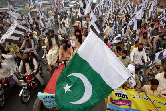 Supporters of Jamat-ud-Dawa participate in an anti-India protest demonstration in Lahore