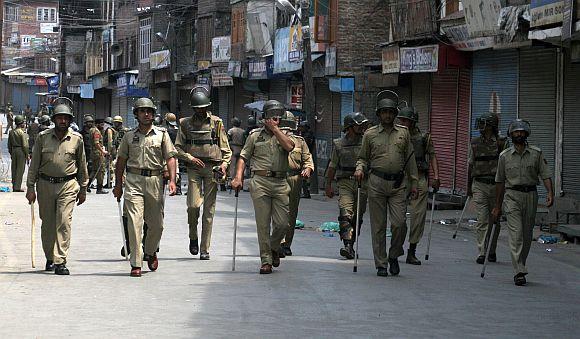 Strict restrictions and tight police vigil was put in place to foil a march to the gutted shrine in Srinagar on Friday