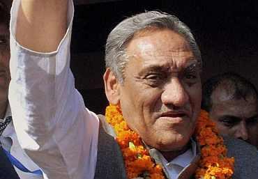 Vijay Bahuguna waves to his supporters