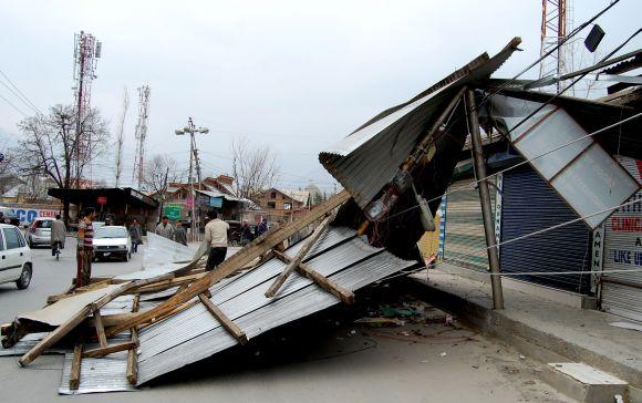 A residential building damaged by the windstorm is seen on the outskirts of Srinagar on Tuesday morning