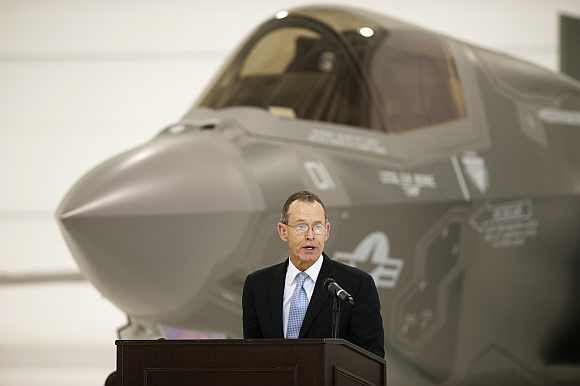 Chairman and CEO of Lockheed Martin, Robert Stevens speaks in front of a US Marine F-35B Joint Strike Fighter Jet during the roll-out ceremony at Eglin Air Force Base in Florida