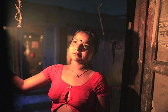 Hashi stands in front of Kandapara brothel to attract customers