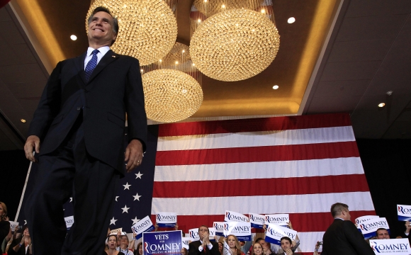 Mitt Romney arrives for his Illinois primary night rally in Schaumburg, Illinois