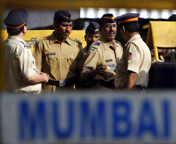 Policemen stand guard outside a jail in Mumbai, where 26/11 terrorist Ajmal Kasab is lodged