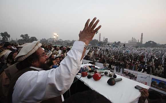 Hafiz Saeed speaks to gathering during an anti-American and Indian rally on the grounds of the Minar-e-Pakistan in Lahore