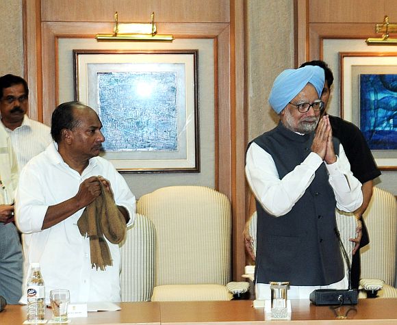 File photo shows Defence Minister A K Antony with Prime Minister Manmohan Singh at a Cabinet meet