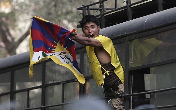 A Tibetan exile shouts Free Tibet slogans from a police vehicle after being detained during a protest against then Chinese president Hu Jintao's visit in March 2012. Photograph: Adnan Abidi/Reuters