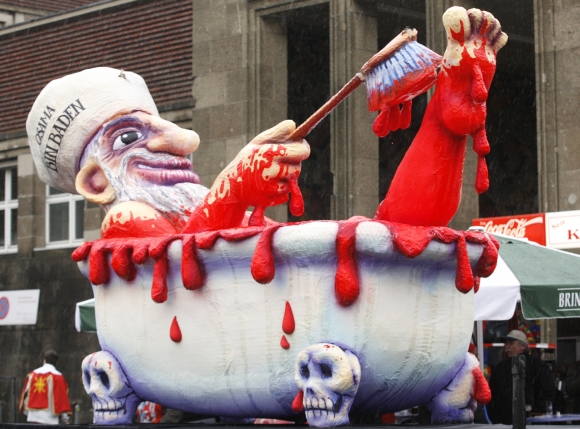 A carnival float carries a large papier-mache figure of Osama bin Laden during the traditional Rose Monday carnival parade in Duesseldorf