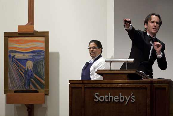 An auctioneer takes bids for the sale of 'The Scream; at Sotheby's in New York May 2