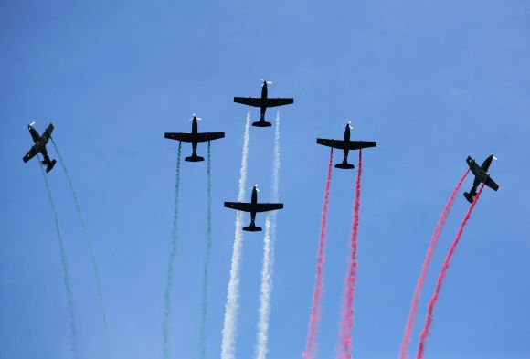 Pilatus PC-7 aircraft fly in formation during an air show in Mexico