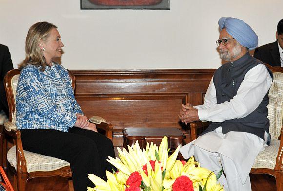 US Secretary of State Hillary Clinton interacts with Indian Prime Minister Manmohan Singh