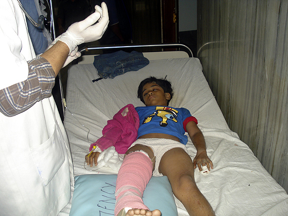 An Indian girl who survived the plane crash receives treatment at a hospital in Pokhara