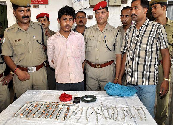 GRP personnel with Mantu Singh, who was arrested with explosives on board the NE Express at Guwahati railway station on Wednesday