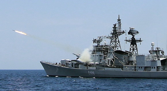 An Indian ship fires a missile during a joint Indo-Lanka naval exercise at Trincomalee navy base in Trincomalee