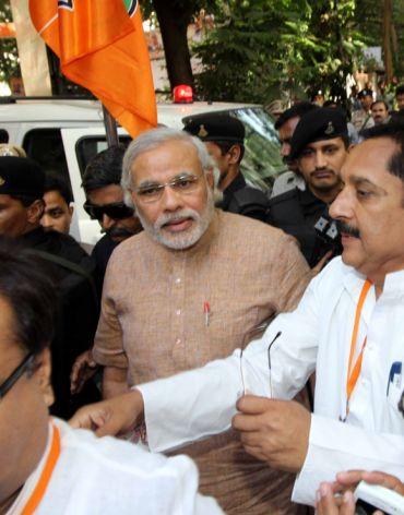 Gujarat Chief Minister Narendra Modi arrives to attend the BJP national executive meeting in Mumbai