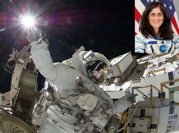 NASA astronaut Sunita Williams, Expedition 32 flight engineer, appears to touch the bright sun