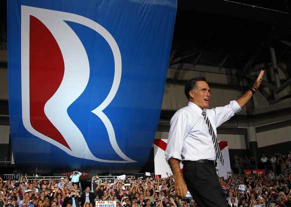 Republican presidential nominee Mitt Romney takes the stage at a campaign rally in Coral Gables, Florida