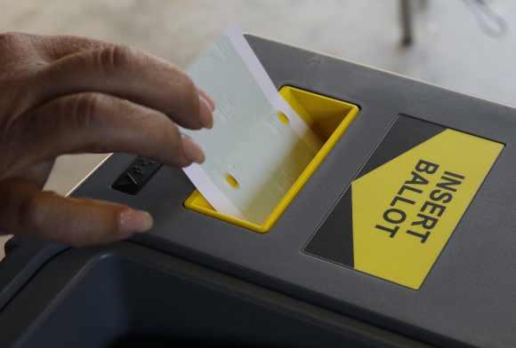 A woman casts her vote at a polling station in Los Angeles