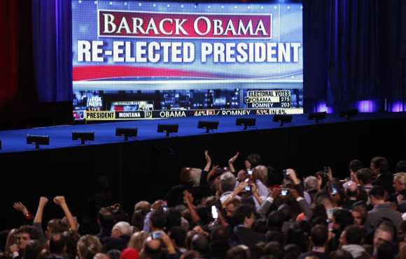 Supporters of US President Barack Obama cheer the news of the President's re-election