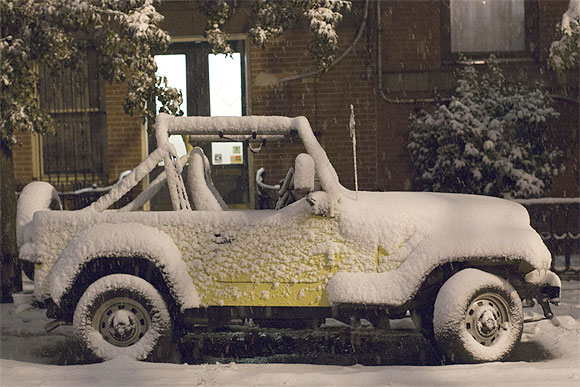 A car is seen covered in snow during the nor'easter, also known as a northeaster storm, in Jersey City, New Jersey