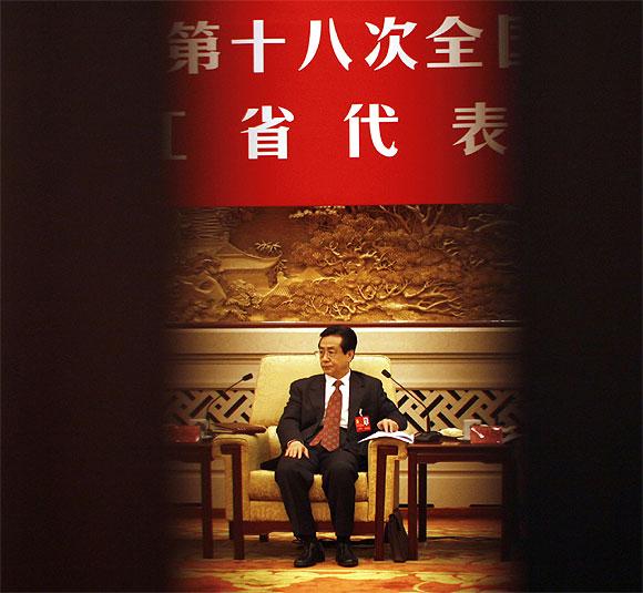 A delegate attends a meeting at the Zhejiang room of the Great Hall of the People, the venue of the 18th National Congress of the Communist Party of China