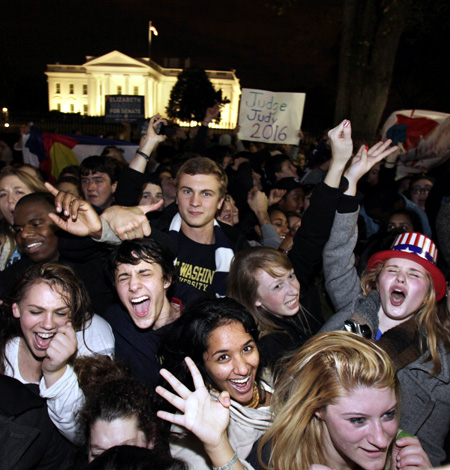 Supporters of US President Barack Obama celebrate the news of his victory in the presidential election outside the White House in Washington