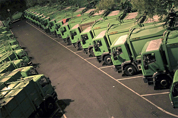 Lisbon's garbage trucks are seen parked at a garage on the beginning of the general strike