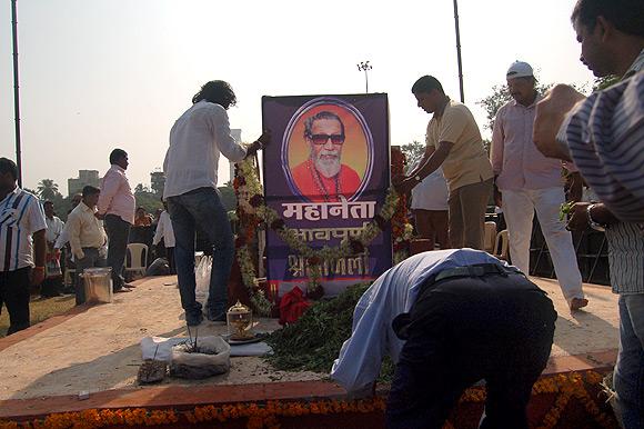 In Mumbai's Shivaji Park, Shiv Sena supporters pay their last respects at the site where Bal Thackeray was cremated on November 19, 2012.