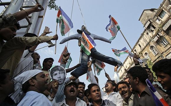 Supporters of the Maharashtra Navnirman Sena hang an effigy of Mohammad Ajmal Kasab outside Chhatrapati Shivaji Terminus train station