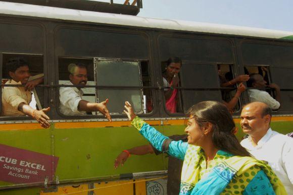 Sharmila Reddy greets people on her way to address a rally