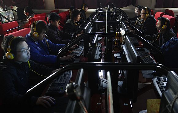 People use computers at an Internet cafe in Changzhi, China