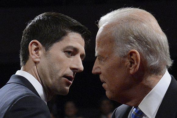 US Vice President Biden and Republican vice presidential nominee Ryan shake hands at the conclusion of the vice presidential debate in Danville