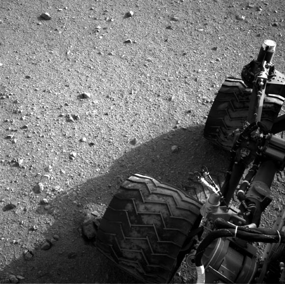 Soil clinging to the right middle and rear wheels of NASA's Mars rover Curiosity can be seen after the rover's third drive on Mars in this handout photo courtesy of NASA.