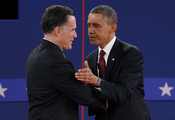 Romney and US President Barack Obama shake hands at the conclusion of the second presidential campaign debate in Hempstead, New York