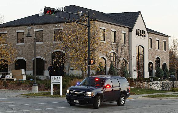 Police guard the Azana Salon and Spa in Brookfield, Wisconsin