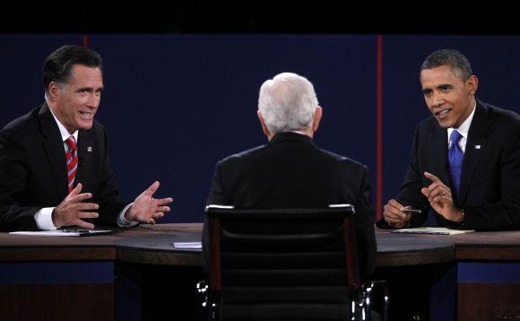 Mitt Romney and US President Obama speak at the same time as moderator Schieffer listens during the final presidential debate in Boca Raton