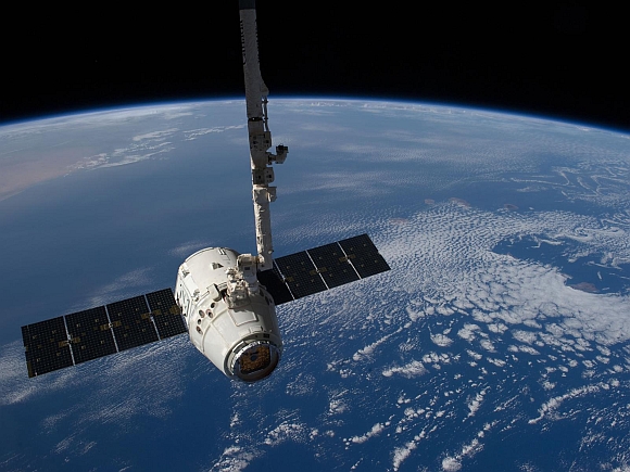 The SpaceX Dragon cargo craft is pictured just prior to being released by the International Space Station's Canadarm2 robotic arm to allow it to head toward a splashdown in the Pacific Ocean