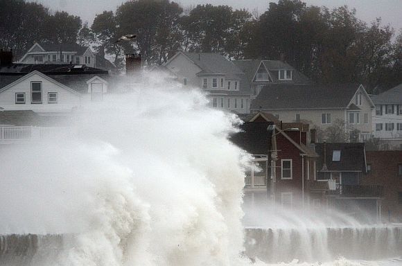 Waves crash over Winthrop Shore Drive as Hurricane Sandy comes up the coast in Winthrop, Massachusetts