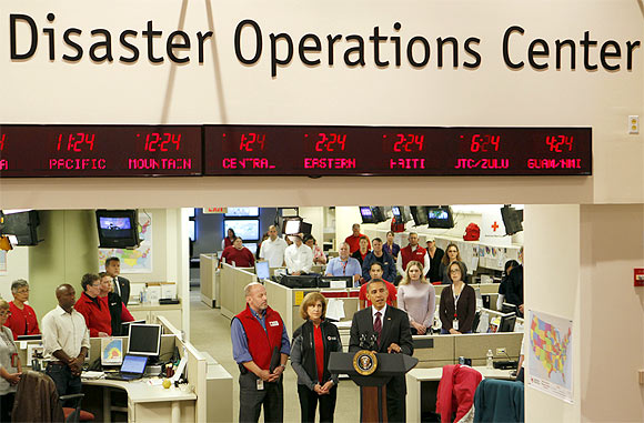 US President Barack Obama talks about the damage done by Hurricane Sandy and rescue efforts while in the Disaster Operations Centre at the National Red Cross Headquarters